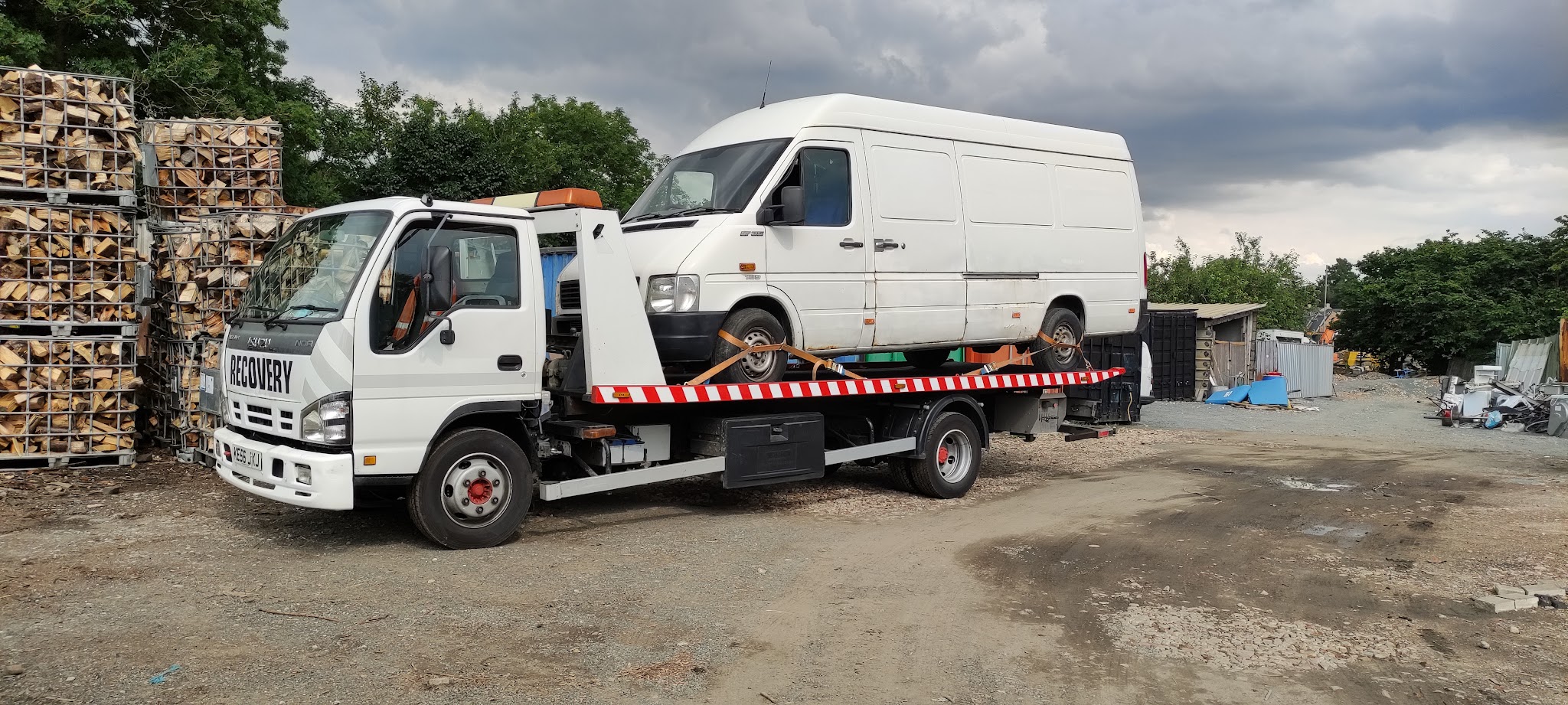 Old Otley Workshop recovery truck carrying a white van